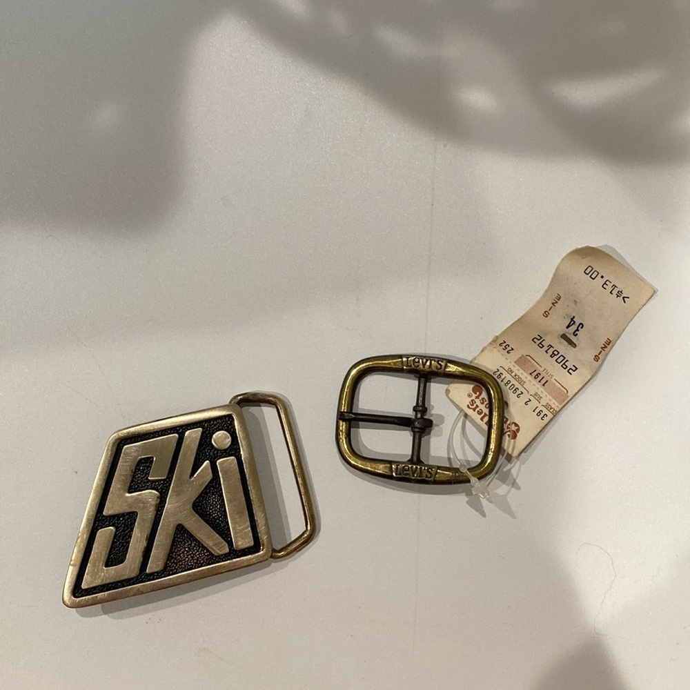 2 belt buckles Ski one is rare so cool! 😎 Levi’s one is small